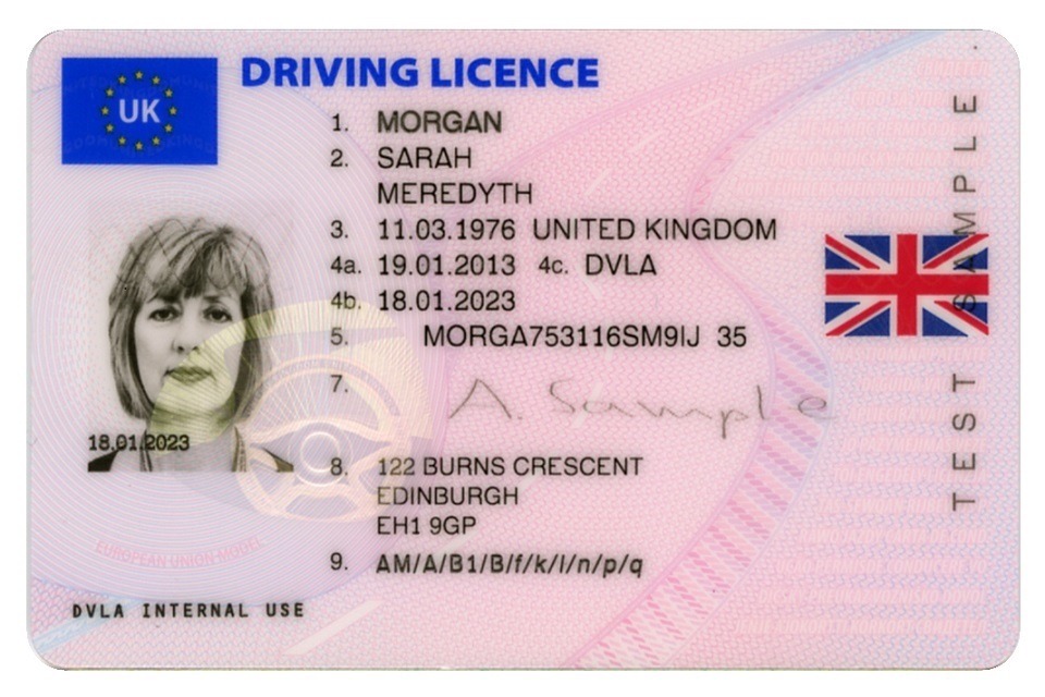 Woman applying for a UK driving licence at DVLA office
